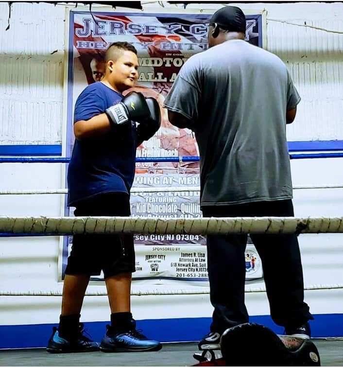 Youth program — hands up, chin down, one round at a time.